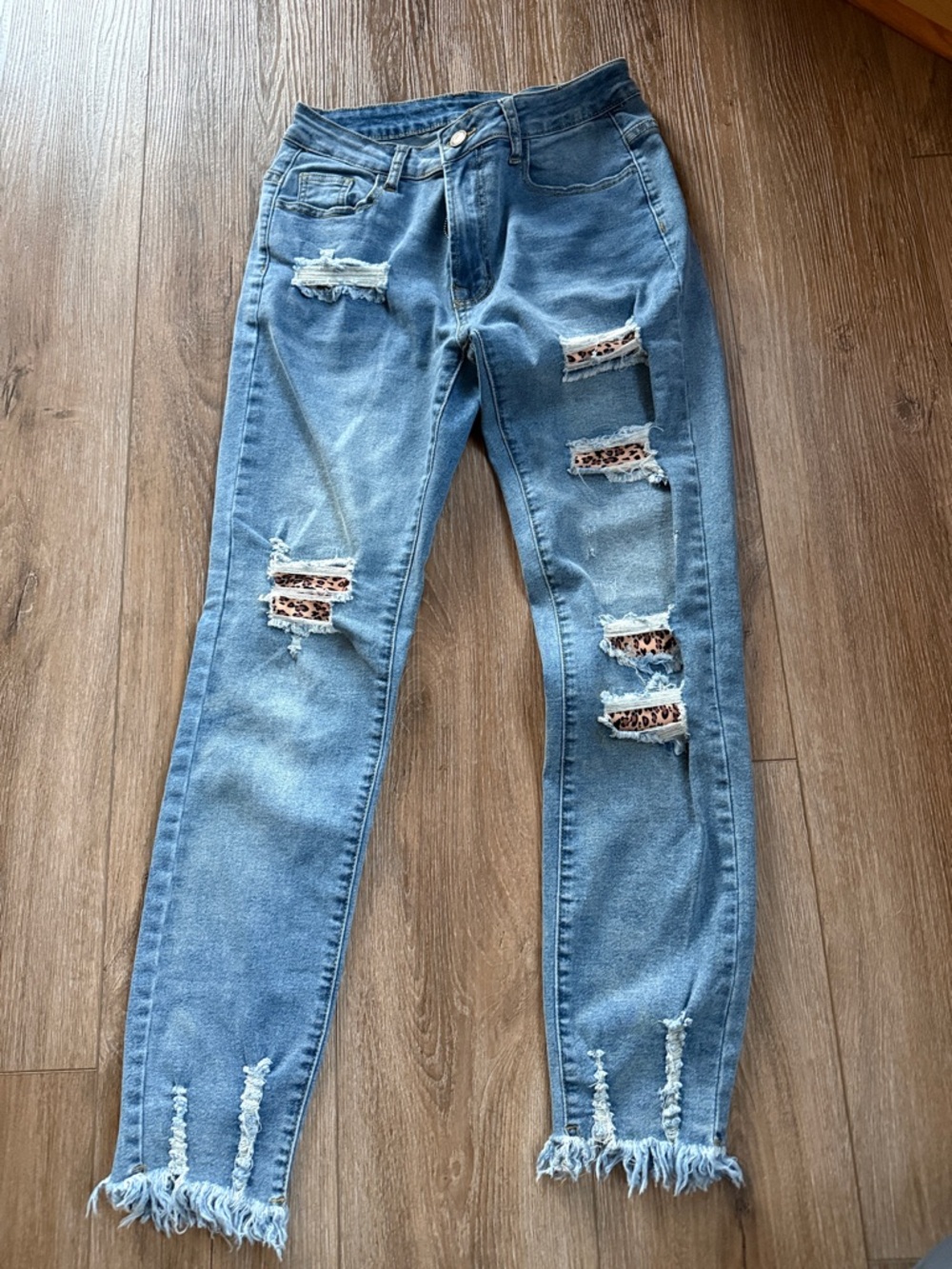 Distressed Light Blue Jeans with Leopard Patch Detail size small